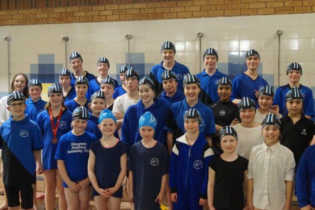 Team Skegness youngsters show off their swim hats.