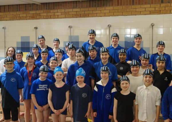 Team Skegness youngsters show off their swim hats.