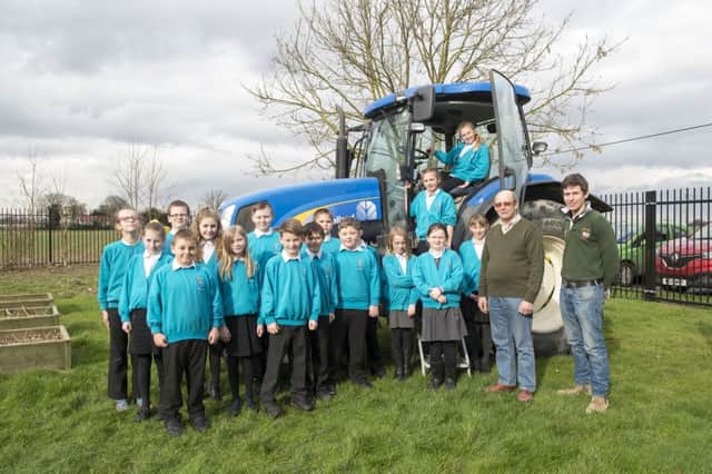 Theddlethorpe Academy.
Visit by two local farmers and a tractor.
Richard Crust (second left) who farms at Manor Farm, Gayton Le Marsh and Matthew Denby (right) who farms at Longlands Farm, Withern .