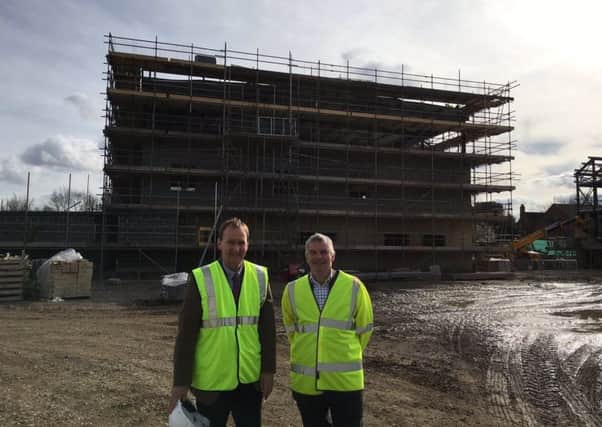 Leader of the County Council Martin Hill (right) with executive councillor Nick Worth, inspect the new Sleaford fire station taking shape. EMN-170320-195626001