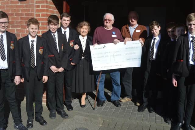Carre's Grammar School students present their money raised by their sponsored walk to Sleaford Dementia Support. EMN-170320-193201001