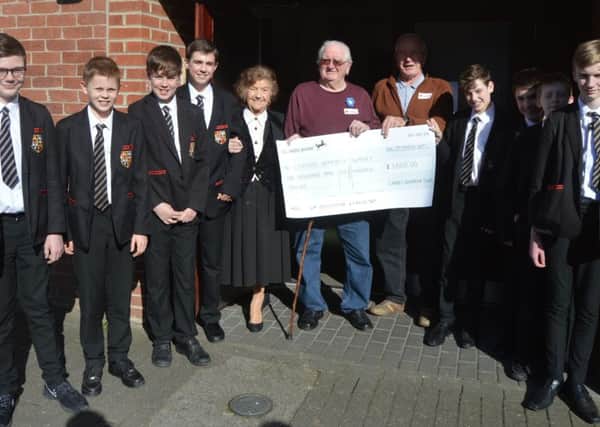Carre's Grammar School students present their money raised by their sponsored walk to Sleaford Dementia Support. EMN-170320-193201001
