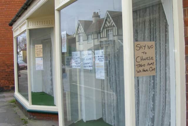 Neighbours have put up posters against the planned takeaway. EMN-170320-184224001