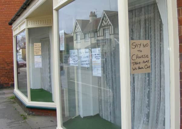 Neighbours have put up posters against the planned takeaway. EMN-170320-184224001
