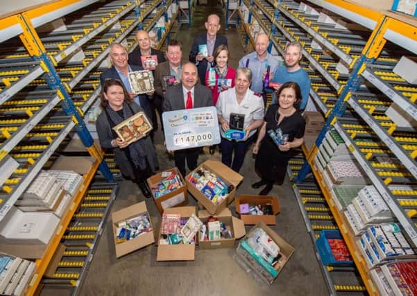 A presentation of money and toiletries raised was made at Lincolnshire Co-ops Pharmacy Warehouse in Lincoln. Pictured from left - (front) Lisa Del Buono from Framework, Lincolnshire Co-op President Stuart Parker, Gayner Ward from The Salvation Army in Skegness and Lincolnshire Co-op Chief Executive Ursula Lidbetter; (back) Malcolm Barham from The Nomad Trust, John Hudson from Emmaus Trust Newark, Robin Barr from Harbour Place in Grimsby, Lincolnshire Co-ops Head of Pharmacy Alastair Farquhar, Centrepoint Bostons Liz Hopkins, Axiom Homeless Actions Pete Middlemiss and Danny Nichols from P3. EMN-170321-091708001