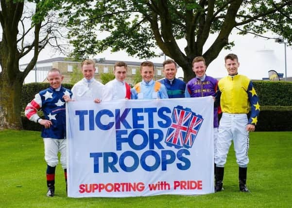 Jockeys get on board to welcome troops. Photo: John Hoy EMN-170321-152408001