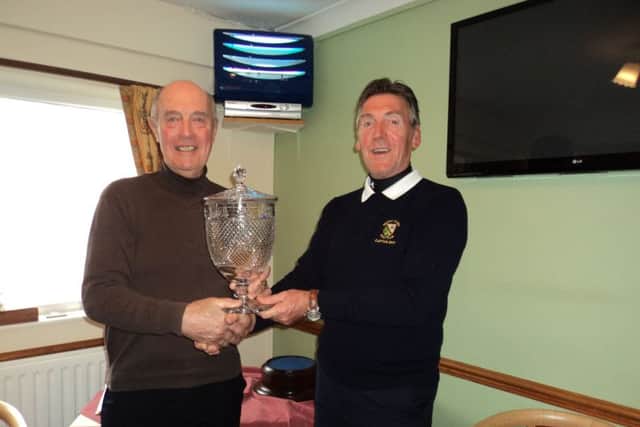 Vice-captain Ian Ribey (left) presents trophy to captain Gaff Elliott. EMN-170322-170516002