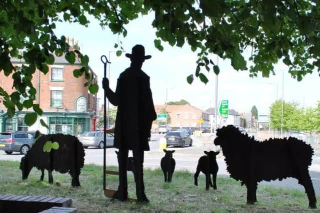 The shepherd and his sheep on Boston's Wide Bargate roundabout.