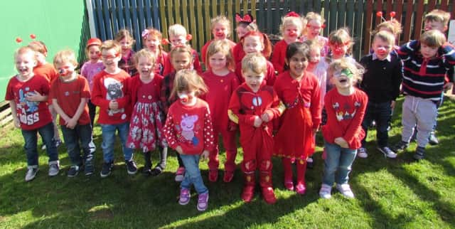 Reception pupils at Spilsby Primary School turned up this morning proudly dressed in red and made a donation to Comic Relief. ANL-170324-122430001