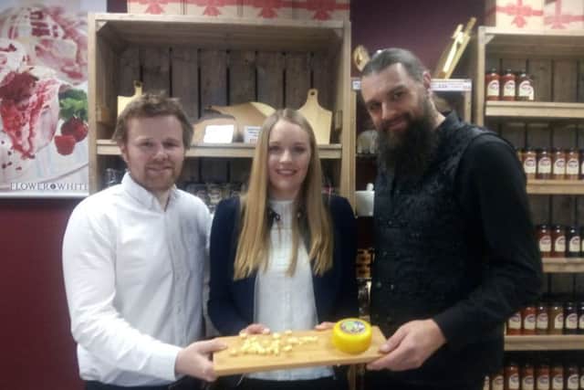 Stuart Colclough and Emma Smith of the Chuckling Cheese Company in Skegness with Gary Starr, chairman of Skegness Carnival with the new Skegness Carnival cheese which is raising money for the event. ANL-170324-125435001