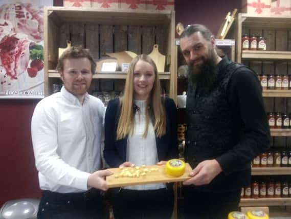 Stuart Colclough and Emma Smith of the Chuckling Cheese Company in Skegness with Gary Starr, chairman of Skegness Carnival with the new Skegness Carnival cheese which is raising money for the event. ANL-170324-125435001