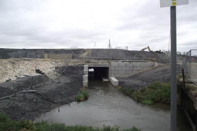 A section of the new flood defences which carry the Bain through the dam. Photo: Bob Wayne