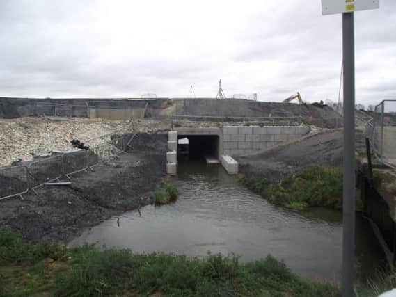 A section of the new flood defences which carry the Bain through the dam. Photo: Bob Wayne