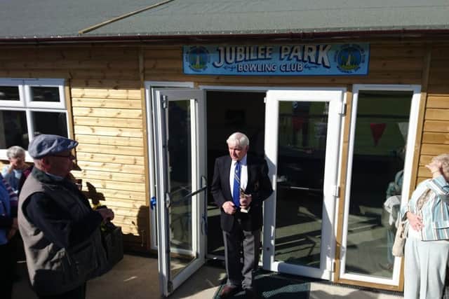 John Pask opens the clubhouse.