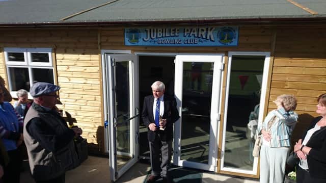 John Pask opens the clubhouse.