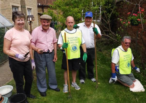 Pictured (from left) gardening in Eslaford Gardens Chris Sharpe, resident, Lion David Chetwood, Lion Paul Sharpe and Lion Bob Coxhead.