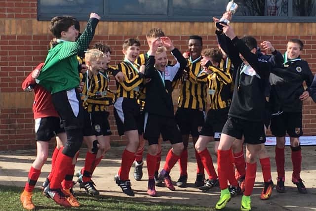 Carres Under 14s celebrate their single-goal victory against Caistor Grammar School EMN-170330-104136002