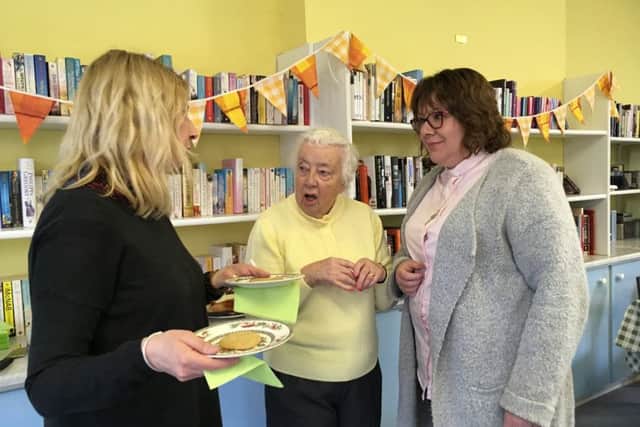 Pictured are Steph Boyfield, Ann Dunn, who got help with her iPad, and the Rev Ann Lett.