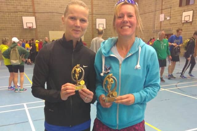 Age group winner Paula Downing (right) with runner-up Wendy Walsh, of St Albans Striders, at the Sandy 10-mile road race EMN-170329-171701002