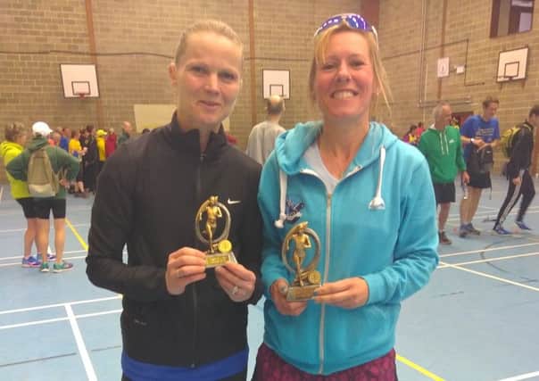 Age group winner Paula Downing (right) with runner-up Wendy Walsh, of St Albans Striders, at the Sandy 10-mile road race EMN-170329-171701002