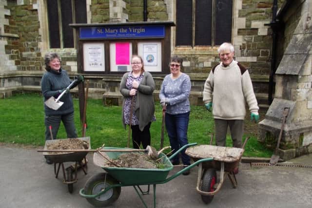 The working party which help tidied the footpaths through the churchyard. EMN-170604-155520001