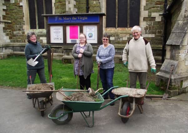 The working party which help tidied the footpaths through the churchyard. EMN-170604-155520001
