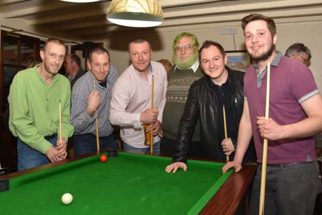 Pool team players from the Crossroads Inn at East Barkwith who will be doing a 24 hour sponsored challenge on April 15 to raise money for We are Macmillan Cancer Support. From left: Paul Brader. David Ward, Leon Andrews. Adge Winstanley, who dyed his hair green raised ?400, Tom Bollan and Sean Radley. EMN-170604-073714001
