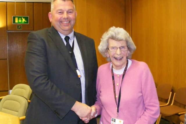 Passing on the baton of leadership. Coun Marion Brighton congratulates new Leader Coun Richard Wright. EMN-170331-094553001