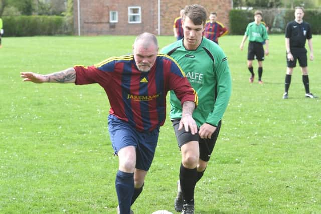 Steve Appleby and Ben Pollard challenge for the ball in Railway's contest against Fulbeck.