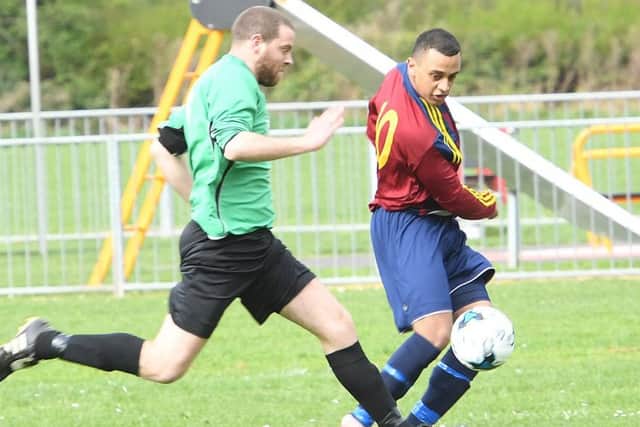 Chris Bates (left) gets in a challenge on  Curt Yeatman in Fulbeck's 7-2 defeat which saw Railway crowned champions EMN-170304-154609002