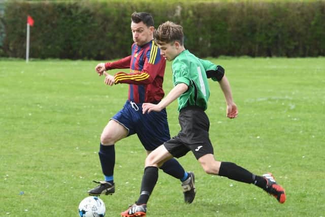 Frasier Harding of Fulbeck (right) battles for possession with Scott Wiseman in their top-of-the-table clash EMN-170304-154622002