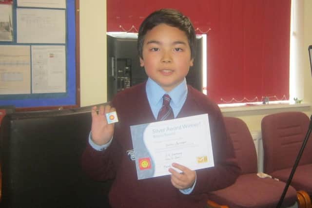 Young mathematician Matthew Springer of Sleaford with his silver award. EMN-170604-155914001