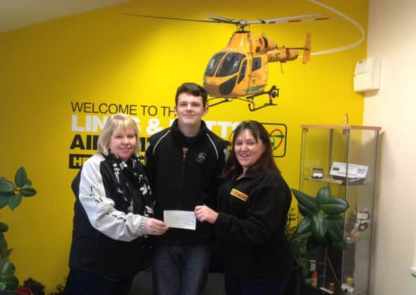 The Lincolnshire Landrover Club recently presented a cheque to the Lincolnshire and Nottinghamshire Air Ambulance.