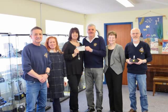 Lion Terry Box presented the cheque to LLBS Fundraising and Publicity Manager Elena Fraser-Green EMN-170414-160500001