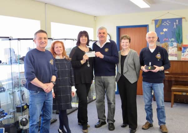 Lion Terry Box presented the cheque to LLBS Fundraising and Publicity Manager Elena Fraser-Green EMN-170414-160500001