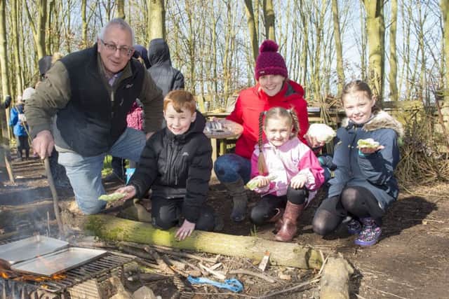 Pictured is education leaders, Richard Dawson and Grace Robinson who cooked fish with pupils Royce Winters, Lilly Hollingsworth and Abbie Tomlinson.