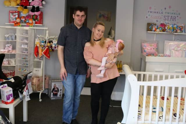 New shop owners Ben Arscott and Charlotte with their baby daughter Amelia.