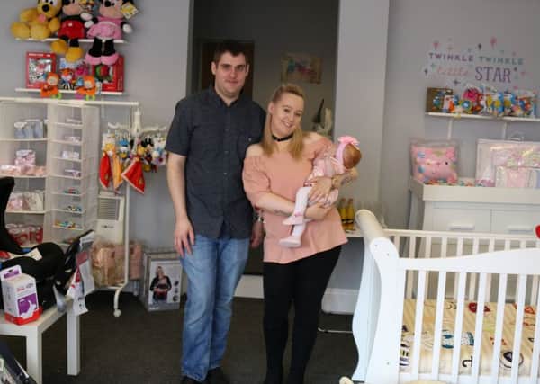 New shop owners Ben Arscott and Charlotte with their baby daughter Amelia.