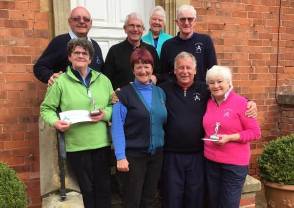 The J and M Trophy raised more than Â£330 for  the captains charities. From left, back  Martin Sizer, Robert Houlton, Jean Sizer, mens captain John Teanby; front  Lesley Walmsley, lady captain Andrea Smaggasgale, seniors captain Malcolm Bood, Lynda Cahalin EMN-171004-161739002