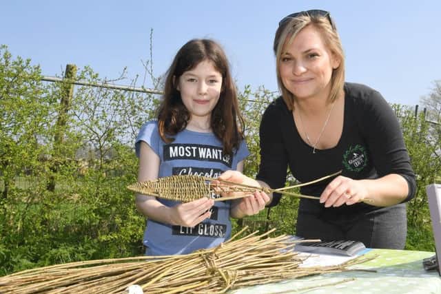 Sleaford heritage trail family arts activities at The Nettles. Jess Notley Willow Weaving with Charlize Davison. EMN-170414-153437001