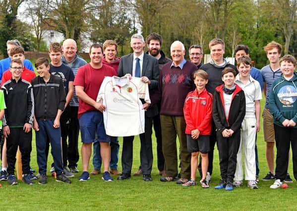 Horncastle CC captain Rob Bee, Chattertons partner Rob Alcock and club president Michael Paige are joined by young members.