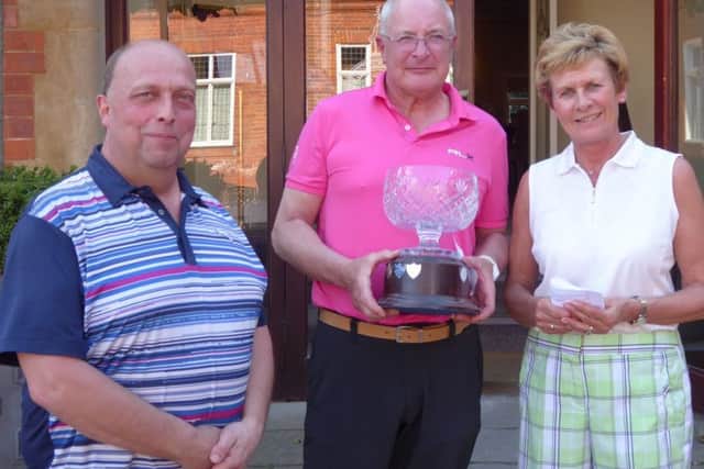 From left, Robert Wilson with Gardner Greensomes winners Steve Langford and Ann Walker EMN-170417-111358002
