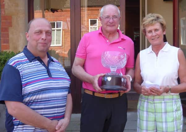 From left, Robert Wilson with Gardner Greensomes winners Steve Langford and Ann Walker EMN-170417-111358002