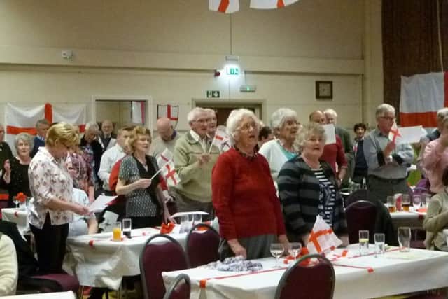 Some of the audience enjoying the flag waving and singing. (Lin) EMN-170425-085804001