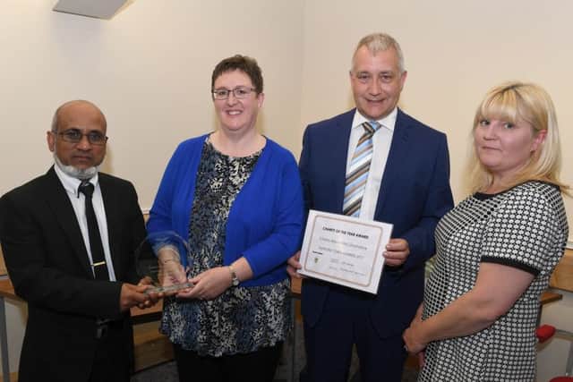 Sleaford Town Awards 2017. Sleaford Mid Lincs Citizens Advice team win the Charity of the Year Award sponsored by the India Garden, presented by proprietor Nadim Aziz. EMN-170424-100417001