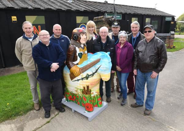 Knight of the Skies from the Lincoln Knights Trail visiting Metheringham Airfield Visitor Centre. Committee members and trustees of Friends of Metheringham Airfield L-R David Thomas, Rod Sanders, Tim Taylor, Jacquie Marson, Jeff Williams, Dick Roberts, Pam Thomas, Andy Marson, John Shipton. EMN-170424-120648001