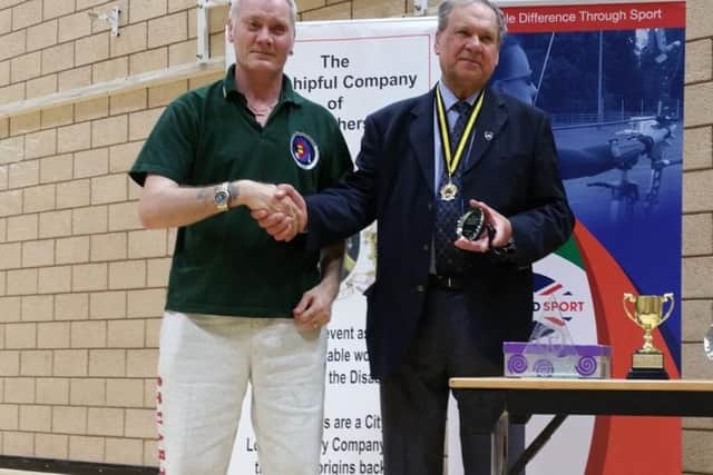 Stuart receives his third place trophy EMN-170419-170858002