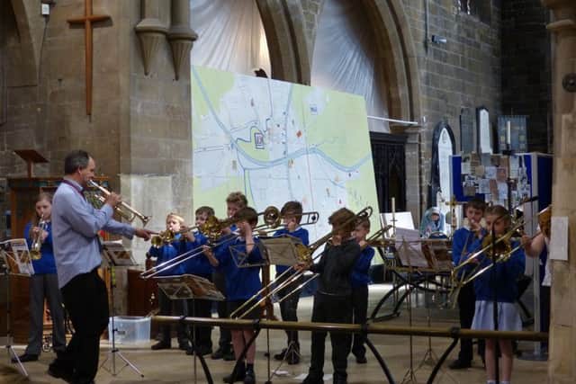 Young brass players bravely held their practice session in church for everyone to hear.