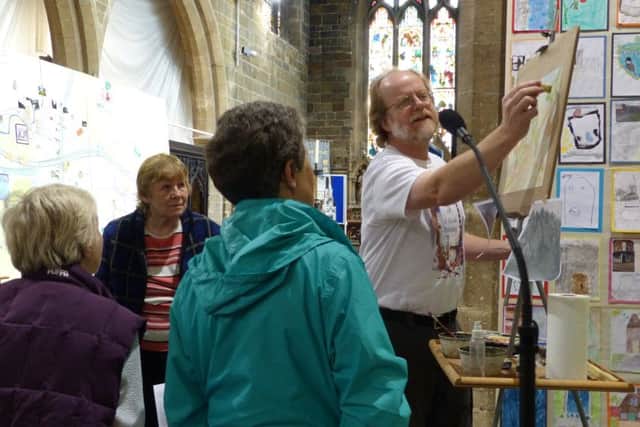 Visitors could get a close up look at  local artist Ash Buckingham at work during last years festival.