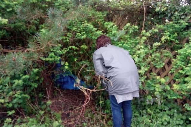 P3 outreach support worker Lauren Gilbertson speaks to a homeless person who has injured his leg. ANL-170413-111055001
